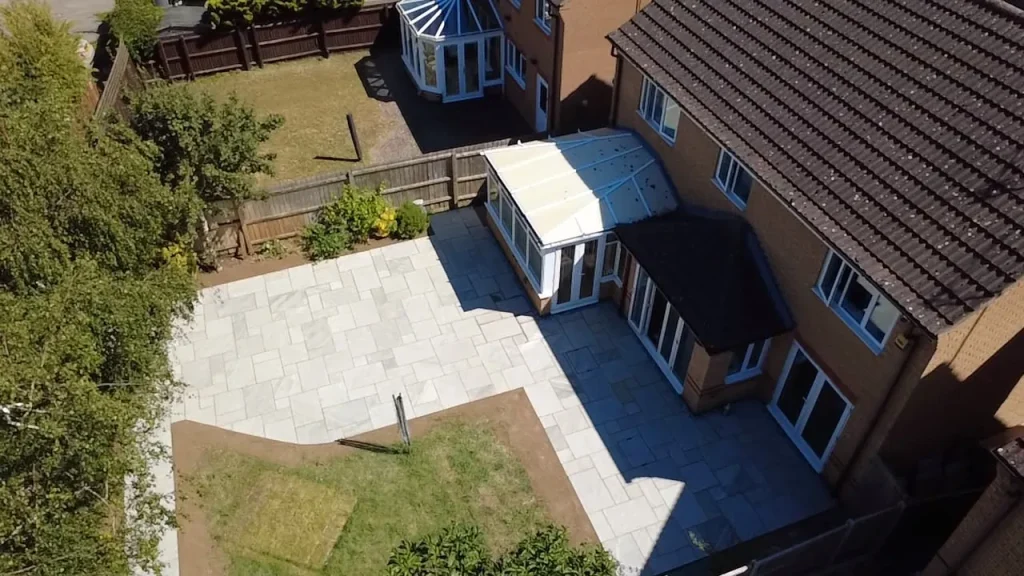Drone view of the sandstone patio wrapping around the house