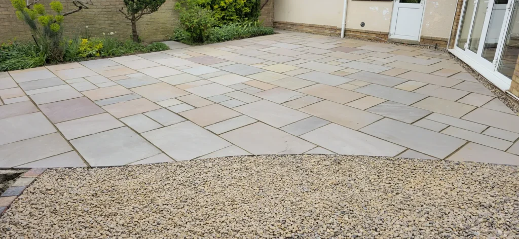 Wide Autumn Brown sandstone patio laid in a random pattern, Weston Favell