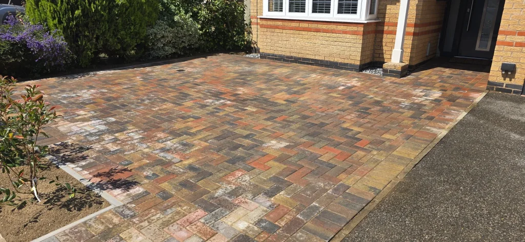 Block-paved driveway extension in an autumn-toned blend, Thrapston