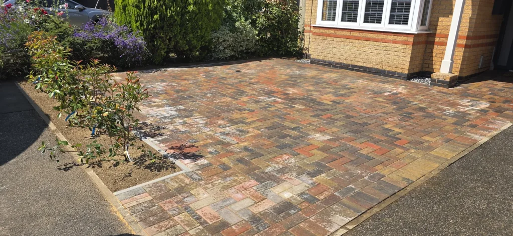 Block paving extending the driveway across the front garden