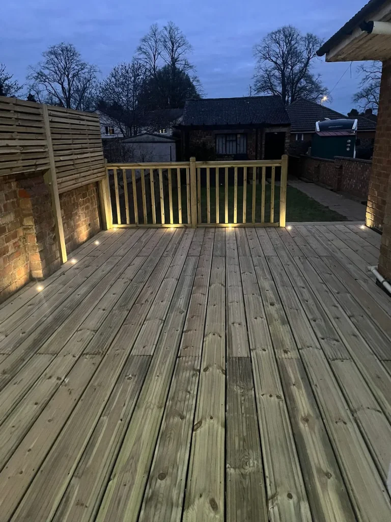 Spotlights set into the decking at dusk