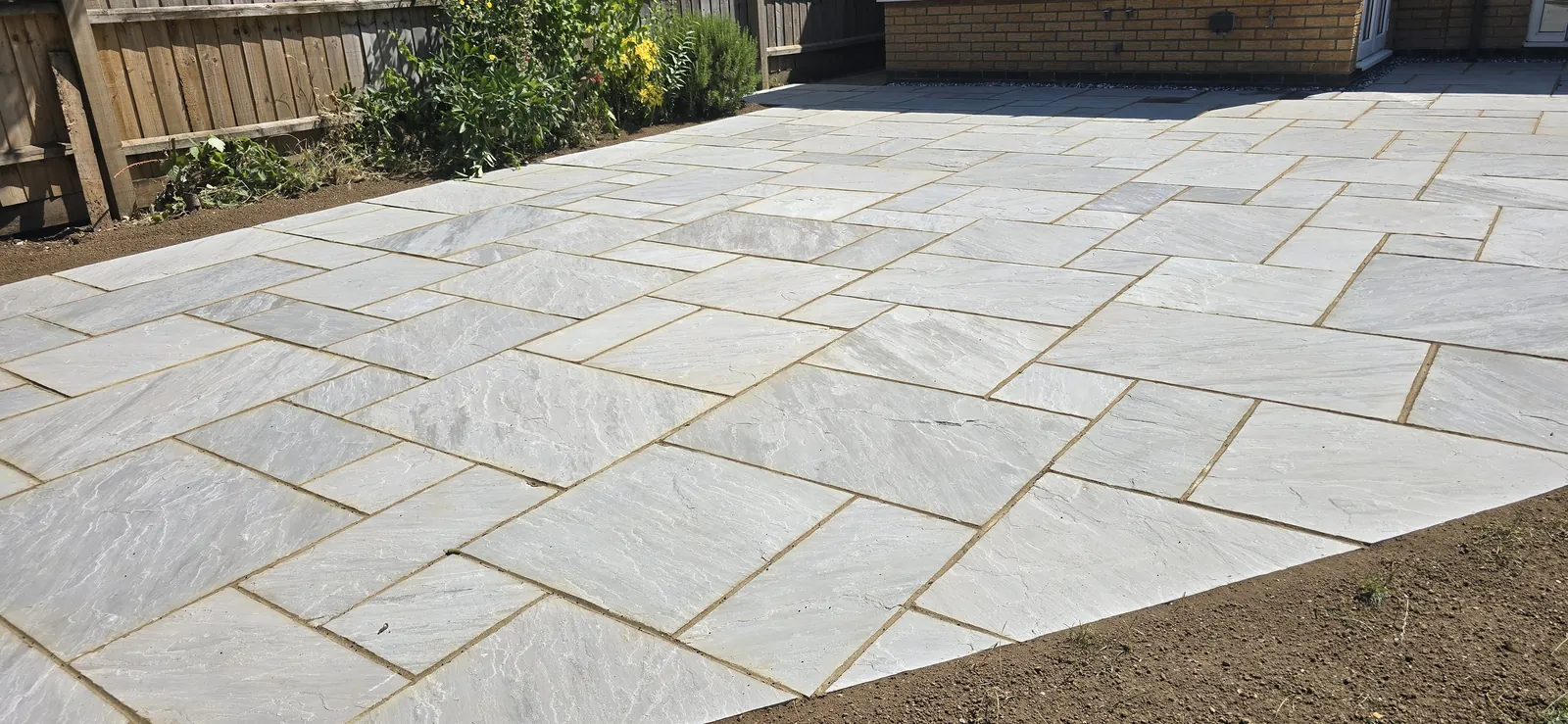 Kandla Grey Indian sandstone patio in a Thrapston garden