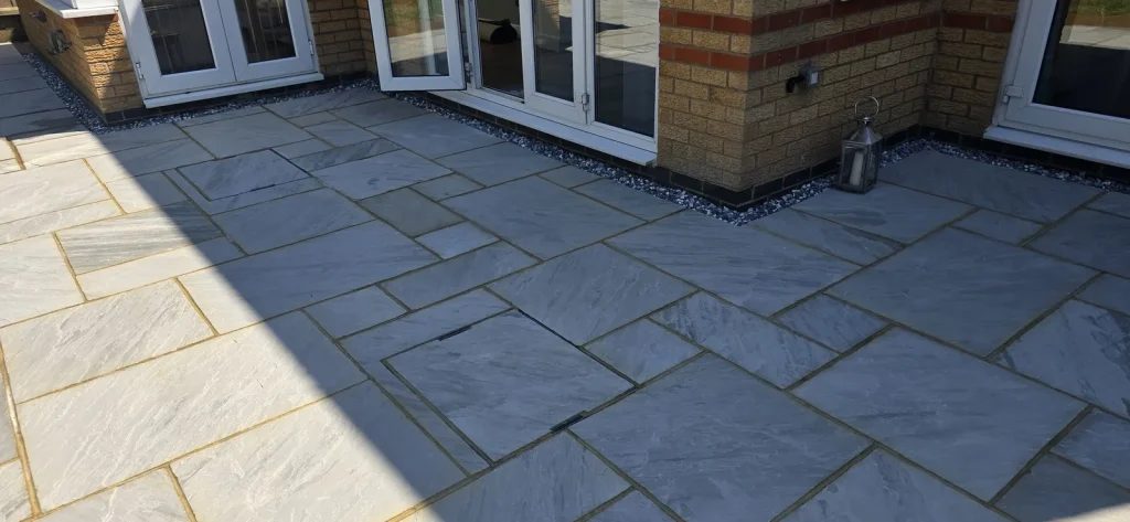 Sandstone patio outside the French doors
