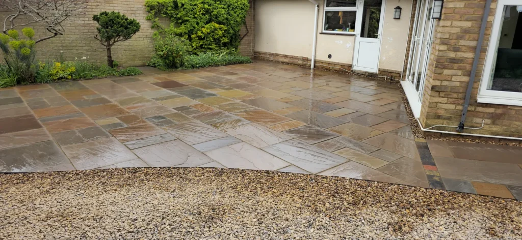 Finished sandstone patio across the back of the house, Weston Favell